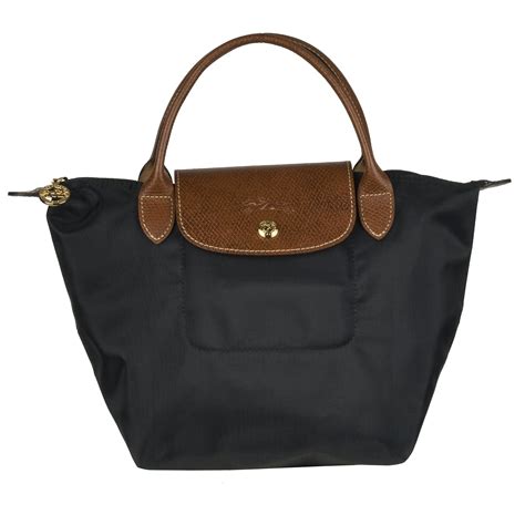 black michael kors bag with brown handles|michael kors brown leather bag.